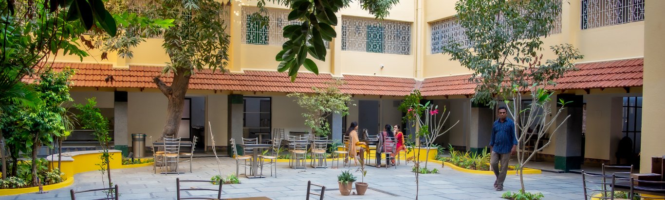 Courtyard seating under shady trees