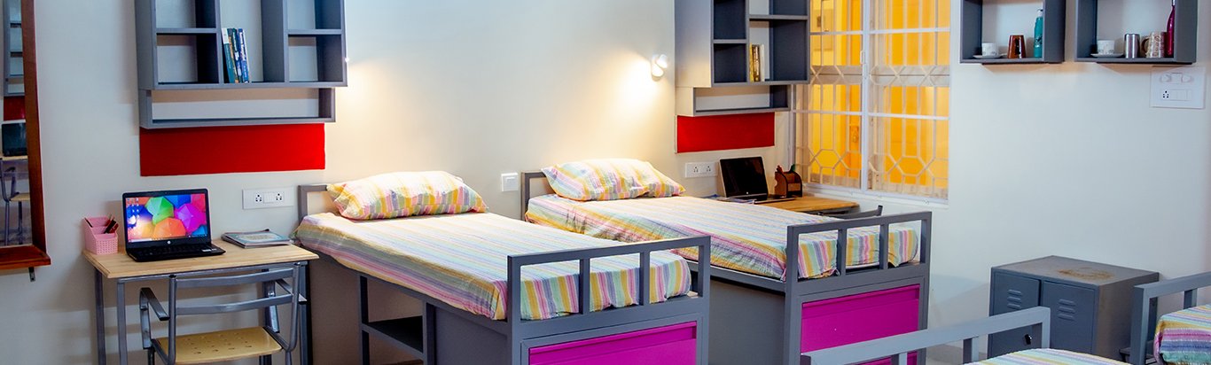 Colorful hostel dorm with beds