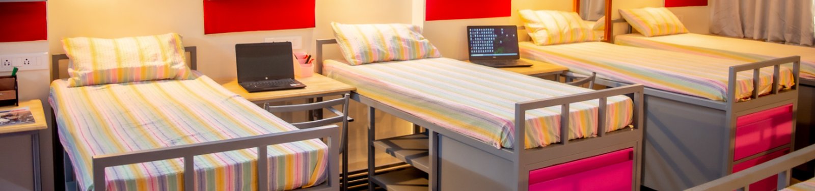 Hostel room with three beds